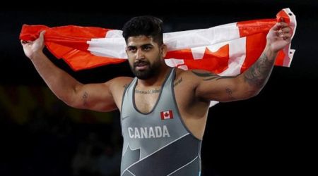 Canada's Amarveer Dhesi celebrates after winning gold. (Reuters)