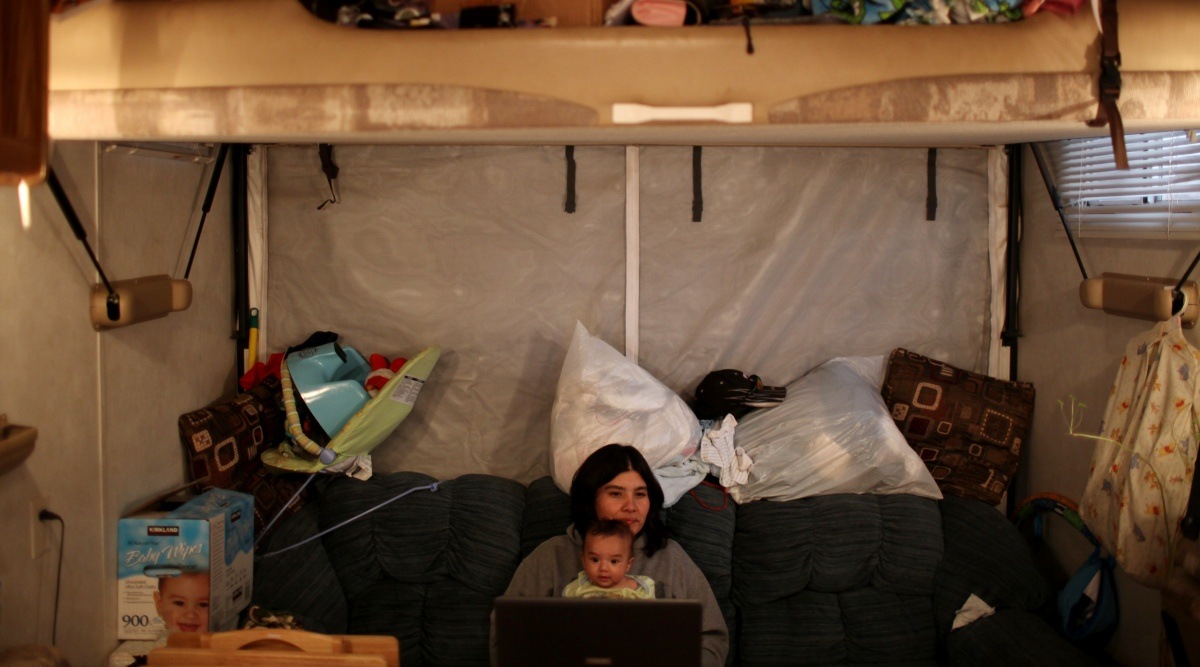  A family at a campground in Williston, N.D., where oil boom workers had to find alternatives to more traditional housing options, March 31, 2010. To understand the strange, conflicting signals being sent by the U.S. economy right now, it helps to look at Williston, N.D., in about 2010. (Todd Heisler/The New York Times)
