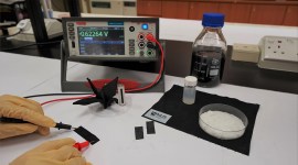 A device that generates electricity from the moisture in air is being tested in this image.