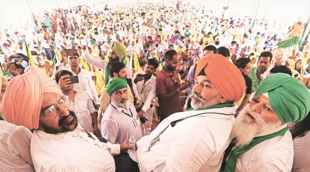 A Large Number of Sikh farmers under banner of Bhartiya Kisan Union sit on 75 hours Dharna Lead by Kisan Union Leader Rakesh Tikait,against Government with the demand of Union Hone Minister for State Ajay Mishra Teni's arrest at Local Mandi in Lakhimpur Khiri on friday. (Express photo by Vishal Srivastav)