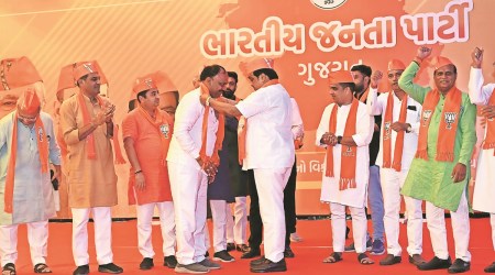 Former Congress MLA Mahendra Baraiya joins BJP in the presence of state party chief CR Paatil on Monday. (Express photo)