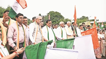  CM Bhupendra Patel and other leaders in Rajkot. (Express Photo)