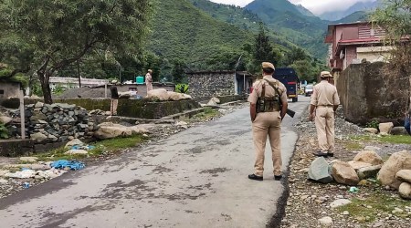 Security personnel stand guard near the encounter site after an attack at an army camp in Darhal area was averted on Thursday. (Photo: PTI)