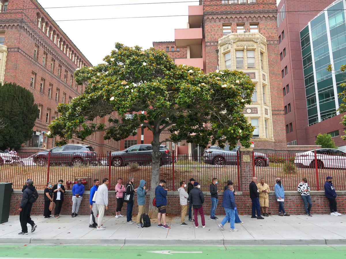 People wait in line for monkeypox vaccinations outside Zuckerberg San Francisco General Hospital in San Francisco, Aug. 1, 2022. (Jim Wilson/The New York Times)