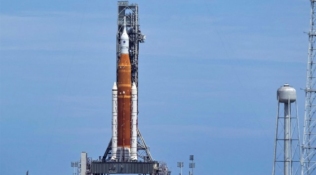 NASA's next-generation moon rocket, the Space Launch System (SLS), with the Orion crew capsule perched on top, stands on launch complex 39B