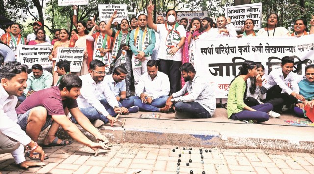 NCP workers play some games as part of a protest held on Fergusson College Road in Pune on Monday.  (Express Photo by Oshwin Kadhao)