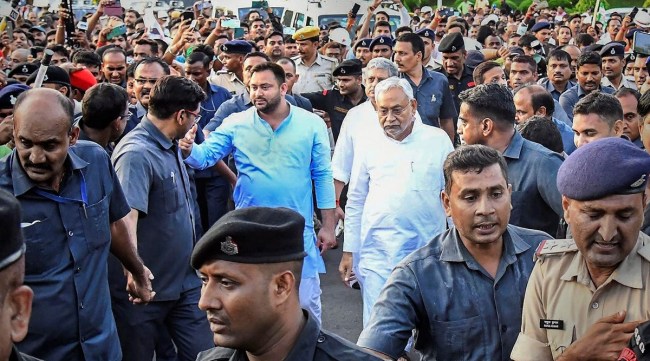 JD(U) leader Nitish Kumar and RJD leader Tejashwi Yadav leave after meeting Bihar Governor Phagu Chauhan, in Patna, Aug. 9, 2022. (PTI)