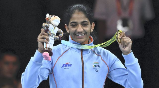 Gold medalist India's Nitu Ghanghas poses for photographs during the presentation ceremony of the women's over 45-48kg (Minimumweight) boxing event, at the Commonwealth Games 2022. (PTI)