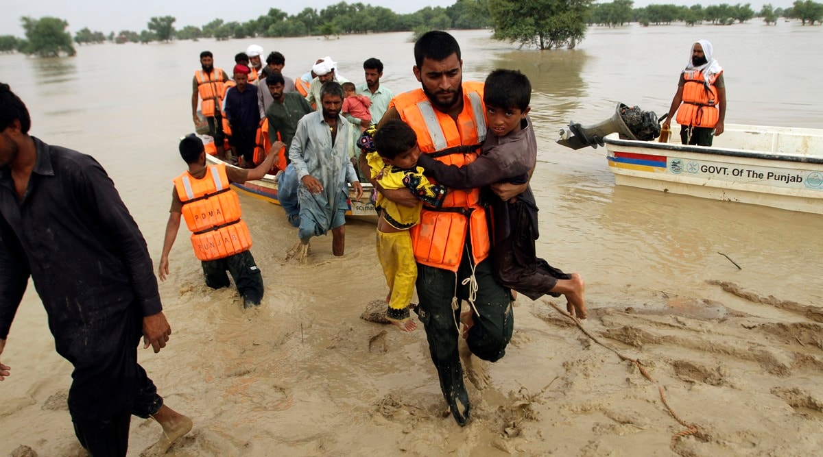 Army troops evacuate people from a flood-hit area in Rajanpur, district of Punjab, Pakistan(AP Photo/Asim Tanveer)