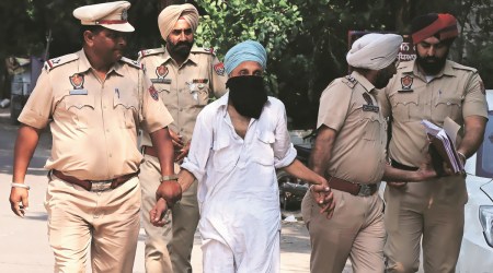 Police with arrested accused Swaran Singh in Ludhiana on Sunday. (Express Photo by Gurmeet Singh)