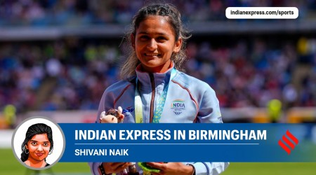 Women's 10,000 meters walk silver medalist, Priyanka, of India, stands on the podium during the athletics in the Alexander Stadium at the Commonwealth Games in Birmingham. (AP/PTI)