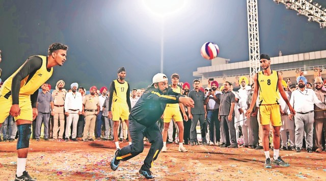 Punjab CM Bhagwant Mann tries his hand at volleyball after inaugurating ‘Khedan Watan Punjab Dian’ on Monday. (Express photo)