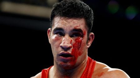 India's Sagar Ahlawat bleeds during the bout against Delicious Orie of England. (Reuters)