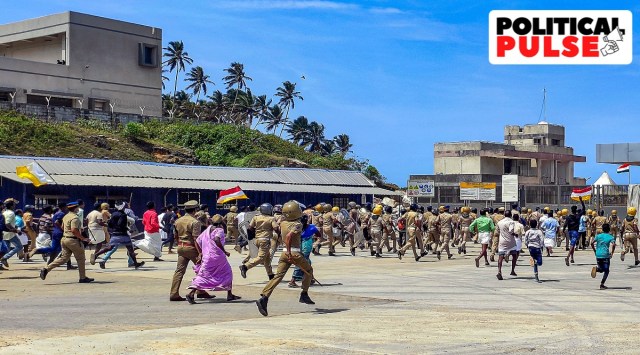 Security personnel attempt to disperse fishermen and activists during a protest against Adani port project in Vizhinjam, in Thiruvananthapuram, Friday, Aug. 19, 2022. (PTI Photo)