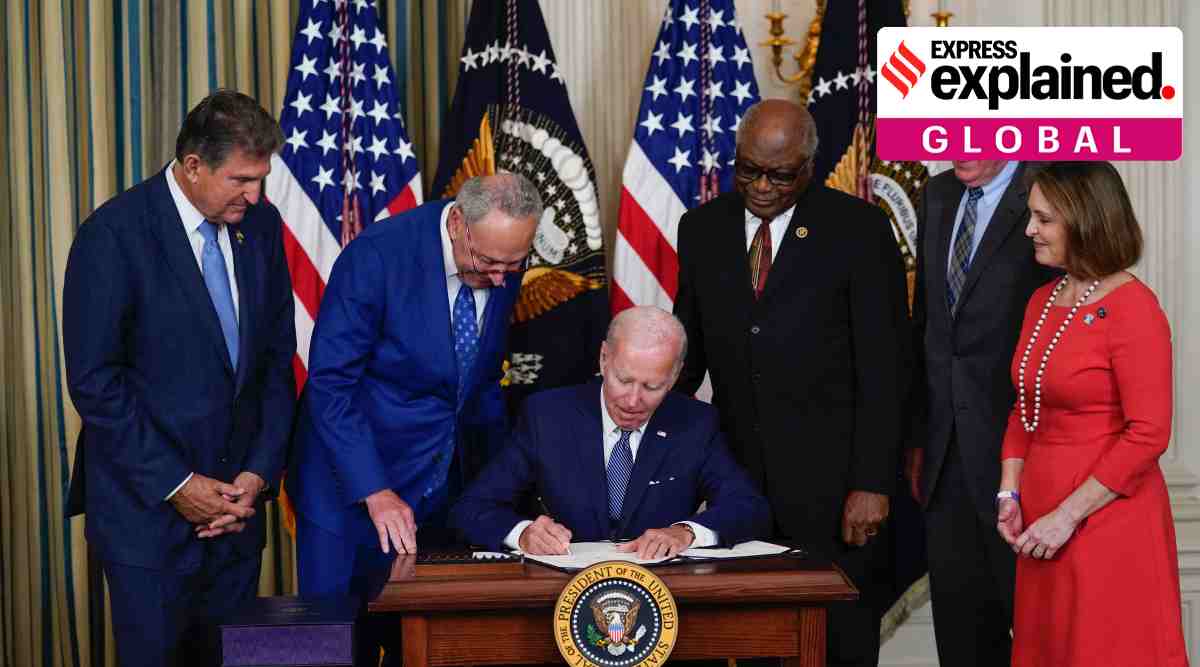 President Joe Biden signs the Democrats' landmark climate change and health care bill in the State Dining Room of the White House in Washington, Tuesday, Aug. 16, 2022, as from left, Sen. Joe Manchin, D-W.Va., Senate Majority Leader Chuck Schumer of N.Y., House Majority Whip Rep. James Clyburn, D-S.C., Rep. Frank Pallone, D-N.J., and Rep. Kathy Castor, D-Fla., watch. (AP Photo)