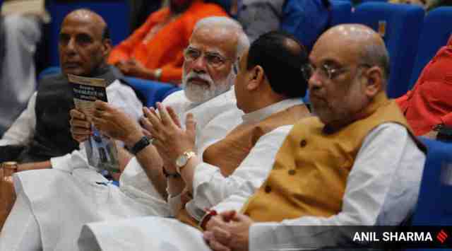 Prime Minister Narendra Modi with BJP national president J P Nadda and Home Minister Amit Shah during a BJP parliamentary board meeting in New Delhi.  Union Defence Minister Rajnath Singh is seen in the background. (Express Photo: Anil Sharma, File)