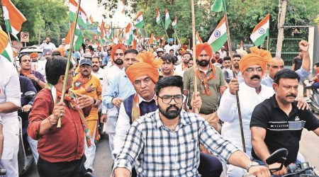 Union Health Minister Mansukh Mandaviya on bike  during the Tiranga rally of BJP in Ludhiana on Saturday.Express Photo by Gurmeet Singh