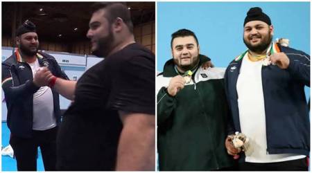 Pakistan's Noon Dastgir Butt  celebrates his gold medal with India’s Gurdeep Singh at Commonwealth Games 2022. (AP)