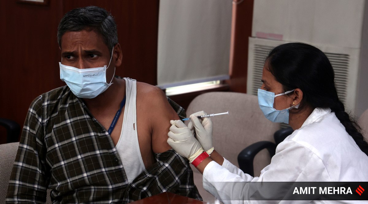 Precautionary doses against Covid-19 being administered in New Delhi. (Express Photo by Amit Mehra)
