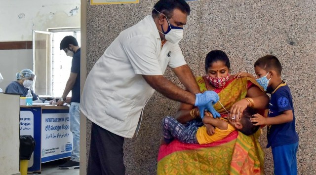 A medic takes a sample from a child for Covid-19 testing in Telangana. (PTI, file)