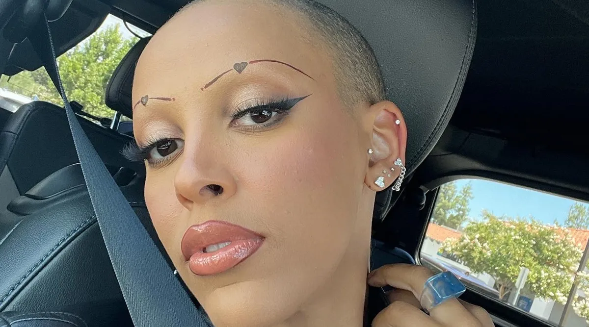 ‘I was never supposed to have hair’ Doja Cat shaves off her head and