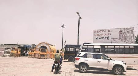 The entrance to the Dreamland Colony has now been turned into a fortress with permanent stationing of a large number of security personnel who often enter into pitched battles with protesters.  (Express Photo by Raakhi Jagga)