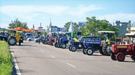 Farmers block the roads by parking tractors on Jalandhar-Ludhiana stretch of National Highway-1. (Express Photo)