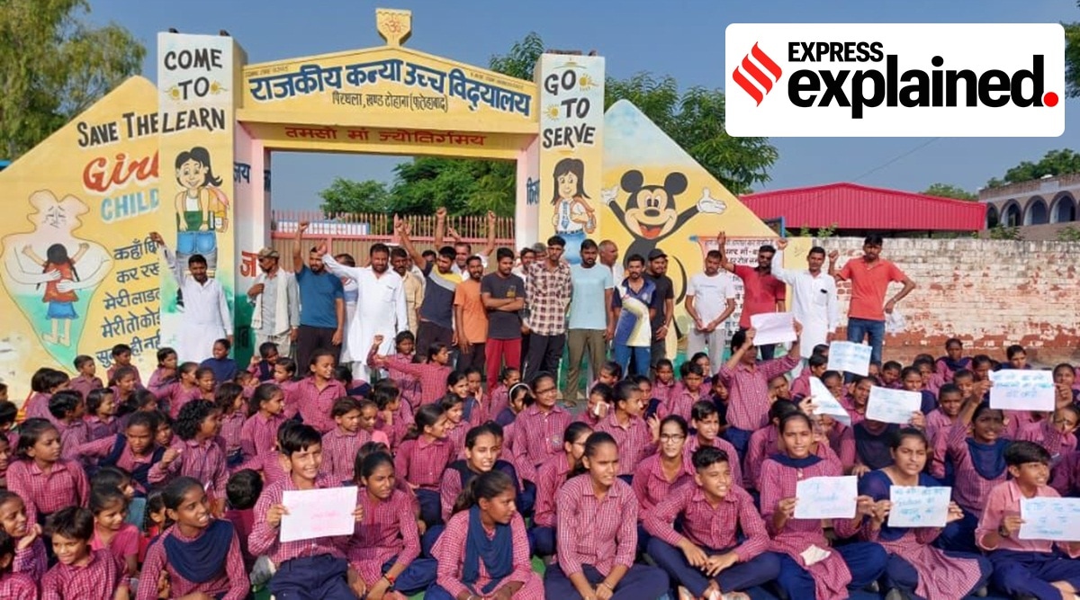 Students and parents protesting outside a government school in Faridabad, Haryana