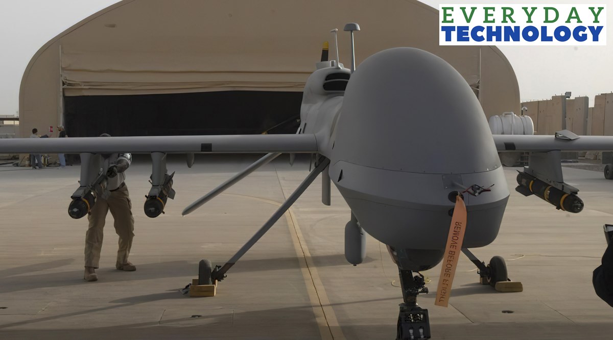 In this image provided by the US Army, contactors from General Atomics load Hellfire missiles onto an MQ-1C Gray Eagle at Camp Taji, Iraq, on Feb. 27, 2011. (Jason Sweeney/U.S. Army via AP)