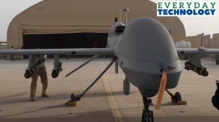 In this image provided by the US Army, contactors from General Atomics load Hellfire missiles onto an MQ-1C Gray Eagle at Camp Taji, Iraq, on Feb. 27, 2011. (Jason Sweeney/U.S. Army via AP)