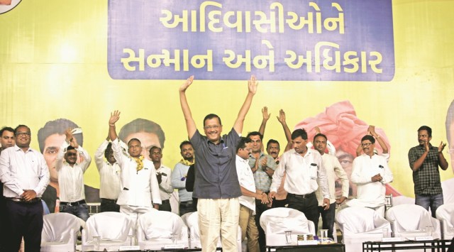 AAP convener Arvind Kejriwal address a tribal rally at the APMC market of Bodeli in Chhota Udepur on Sunday. (Express Photo by Bhupendra Rana)