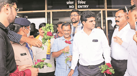Arvind Kejriwal is welcomed at Jamnagar airport. (Express Photo)