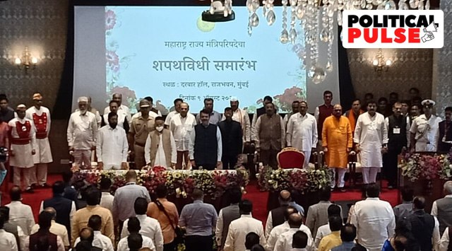 Maharashtra CM Eknath Shinde, Deputy CM Devendra Fadnavis, Governor Bhagat Singh Koshyari and the newly-sworn in ministers. (Express Photo by Amit Chakravarty)