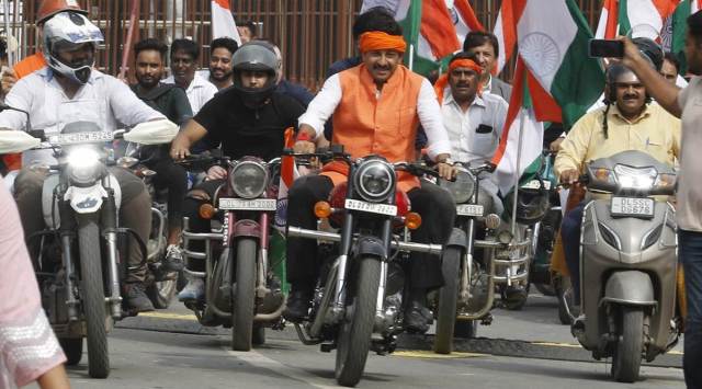 BJP Leader Manoj Tiwari without a helmet at the MPs Tiranga Bike Rally from red Fort to Vijay Chowk in New Delhi on Wednesday. (Express Photo by Anil Sharma)