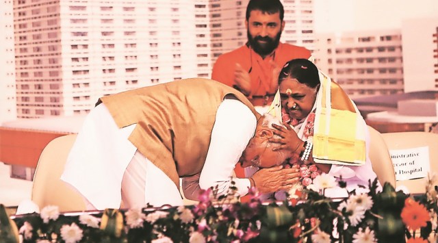 Prime Minister Narendra Modi with spiritual leader Mata Amritanandamayi during the inauguration of Amrita Hospital in Faridabad on Wednesday. (Express photo by Gajendra Yadav)