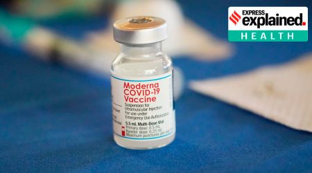 A vial of Moderna COVID-19 vaccine rests on a table at an inoculation station next to Jackson State University in Jackson, Miss., on July 19, 2022. (AP Photo/Rogelio V. Solis)