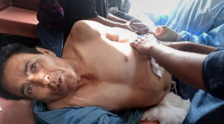 Pintu Kumar, a Kashmiri Pandit who was shot at by militants, being treated at a hospital, in Jammu and Kashmir's Shopian district, Tuesday, Aug. 16, 2022. (PTI)