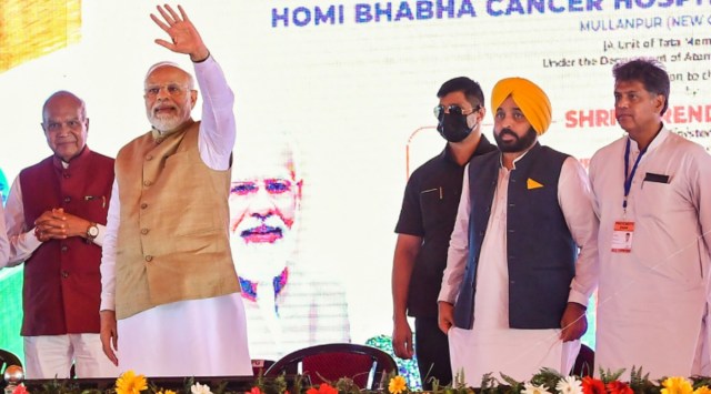 Prime Minister Narendra Modi with Punjab Chief Minister Bhagwant Mann and Punjab Governor and Chandigarh Administrator Banwarilal Purohit during the inauguration of Homi Bhabha Cancer Hospital & Research Centre, in Mohali, Wednesday, Aug. 24, 2022. (PTI Photo)