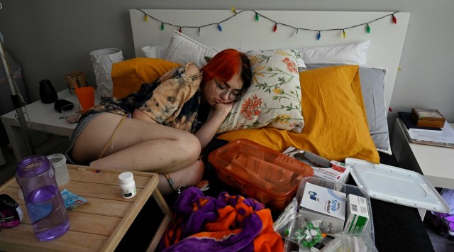 Logan Kelble, who suffers from Ehlers-Danlos Syndrome (EDS), rests on their bed after taking their afternoon medications, at their previous house in the US. (Photo: REUTERS/Magali Druscovich) 