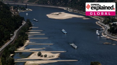 Transport vessels cruise past the partially dried riverbed of the Rhine river in Bingen, Germany, August 9, 2022. (Reuters Photo: Wolfgang Rattay)
