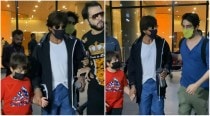 Angry Shah Rukh Khan pulls back as fan grabs his arm at airport, son Aryan Khan calms him down. Watch