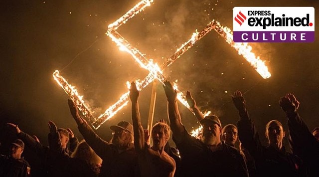 White supremacists give Nazi salutes with a flaming swastika at an undisclosed location in Georgia, United States, in April 2018. (Reuters)