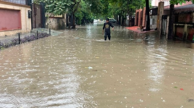 Several vehicles broke down while commuters had to wade through knee-high water in low-lying areas. (Sourced)