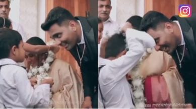 little boy's antics during wedding, boy's prank on groom, boy plays with newly married couple, Kerala wedding, indian express