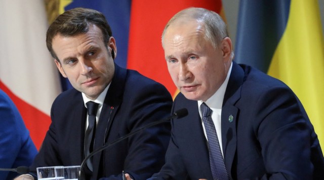 French President Emmanuel Macron and Russian President Vladimir Putin give a press conference after a summit on Ukraine at the Elysee Palace in Paris, December 9, 2019.  Ludovic Marin/Pool via REUTERS/File Photo