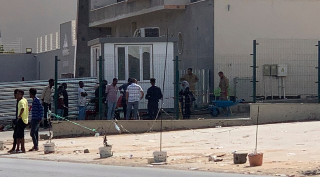 Migrants line up outside a facility operated by the United Nation’s refugee agency, UNHCR, in Tripoli, Libya on Sept. 6, 2022. (AP)