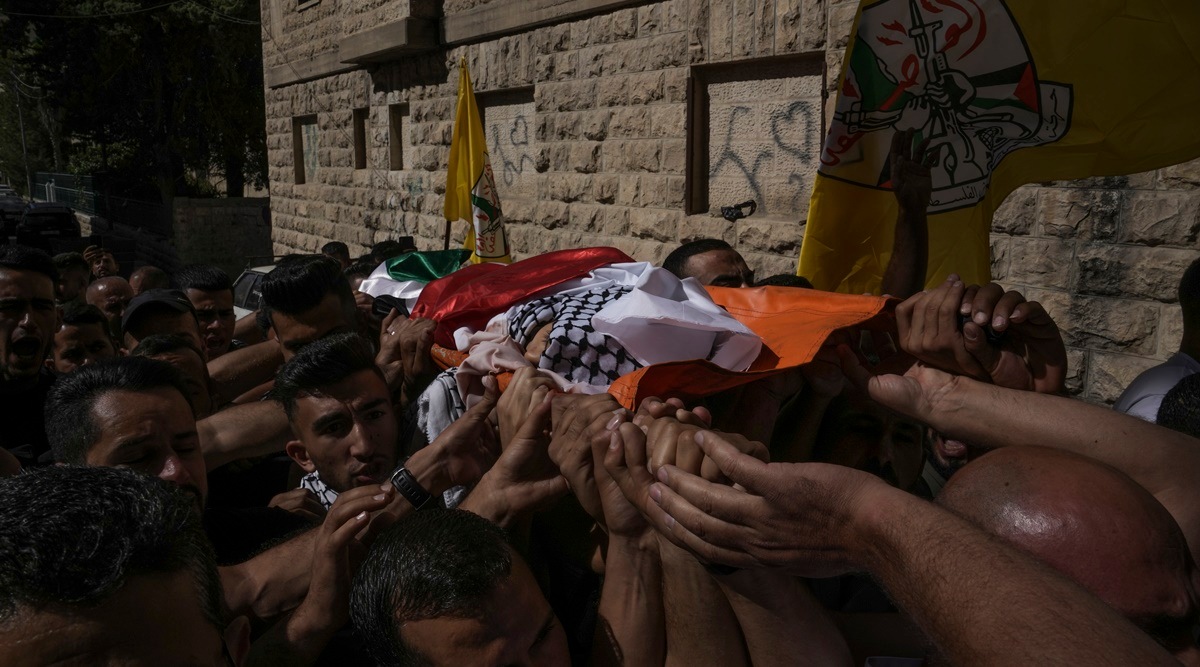 Palestinian mourners carry the body of 7-year-old Palestinian boy Rayan Suleiman, from a hospital in the West Bank village of Beit Jala to his nearby village Friday. (AP)