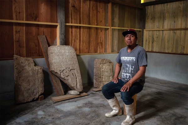 Jacinto Gomez Sanchez, a cattle rancher, with some of the Maya artifacts recovered from the Sak Tz’i’ site 