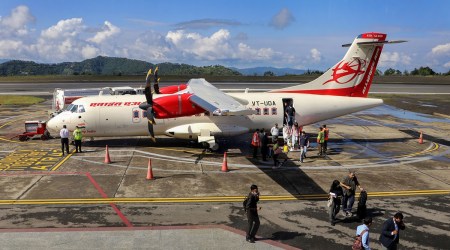 Passengers get off from an aeroplane after daily flights between Delhi and Shimla resumed after two years, at Jubbarhatti airport in Shimla, Monday, Sept. 26, 2022. (PTI)