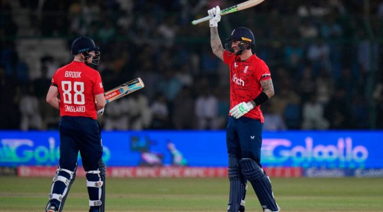 England's Alex Hales, right, celebrates after scoring fifty runs during the first T20 cricket match between Pakistan and England, in Karachi, Pakistan, Tuesday, Sept. 20, 2022. (AP Photo/Anjum Naveed)